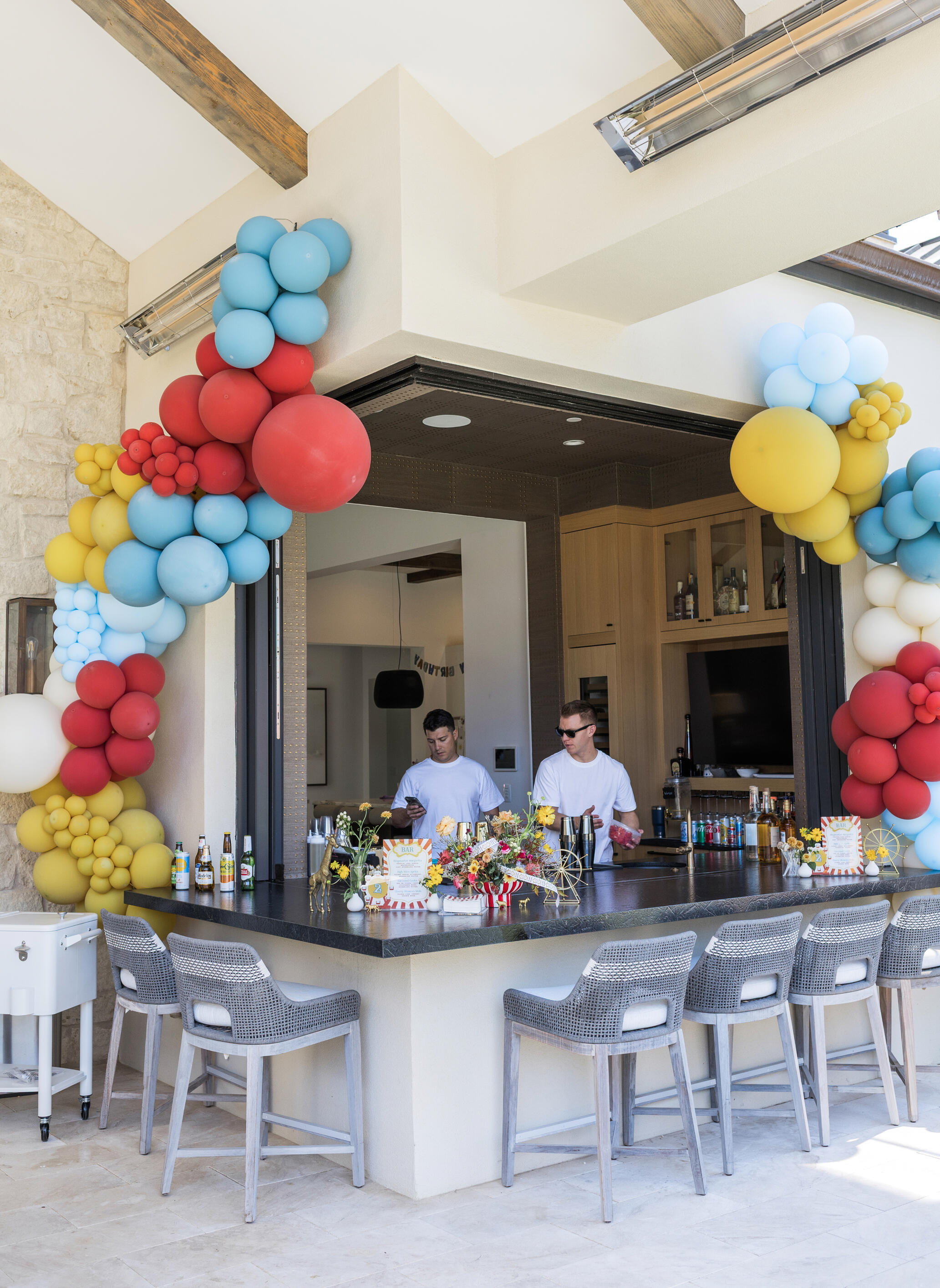 Private Event Bar Setup in Phoenix Bartenders working behind a decorated outdoor bar at a private event in Phoenix, Arizona.