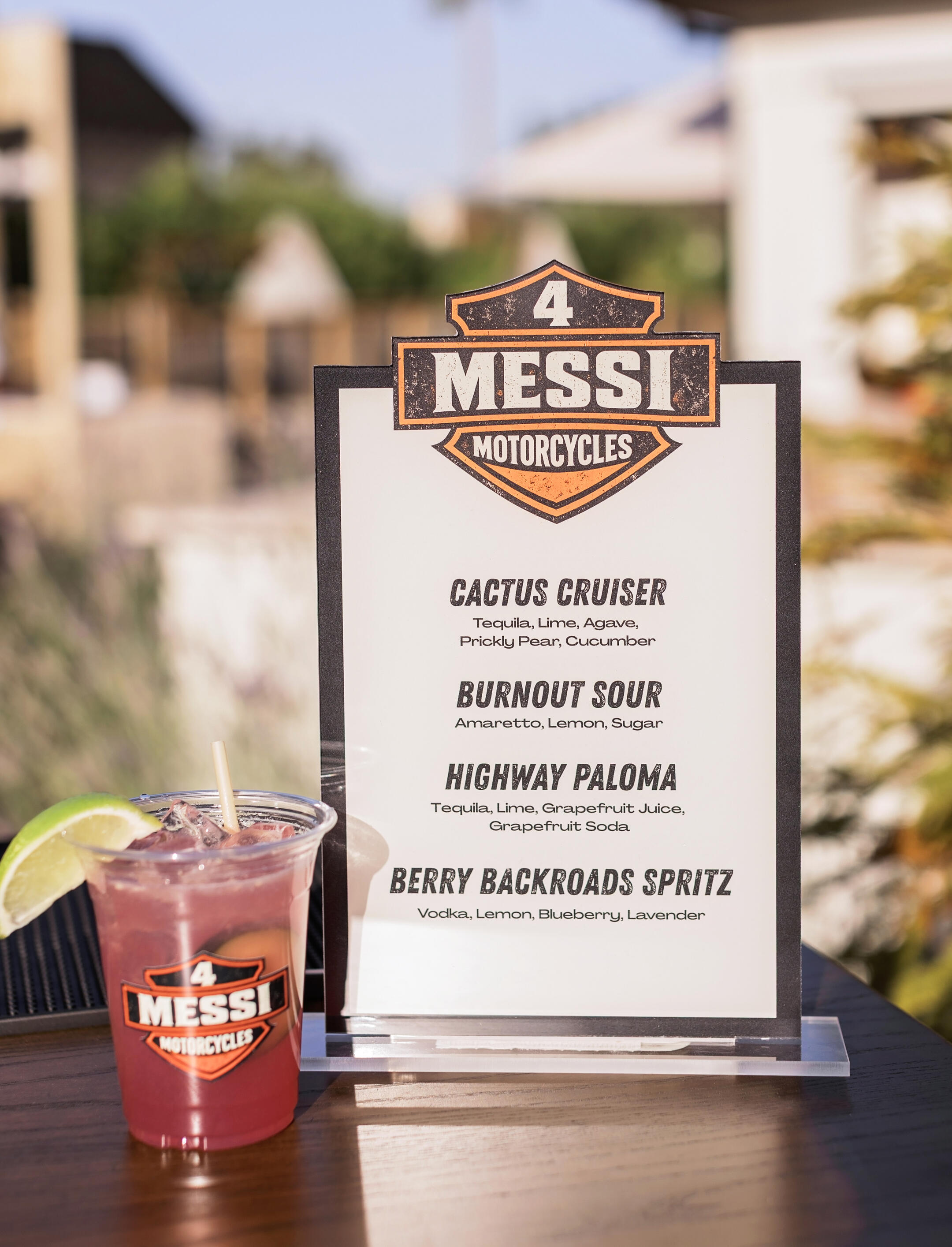 Custom Cocktail Menu for Private Event Custom themed cocktail menu displayed beside a signature drink at a private event.